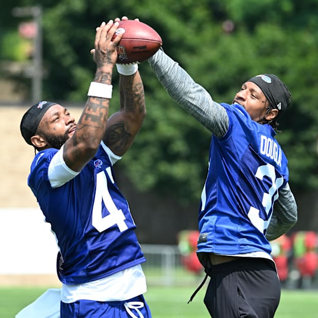 Christian Benford (47) and Rasul Douglas (31) work together