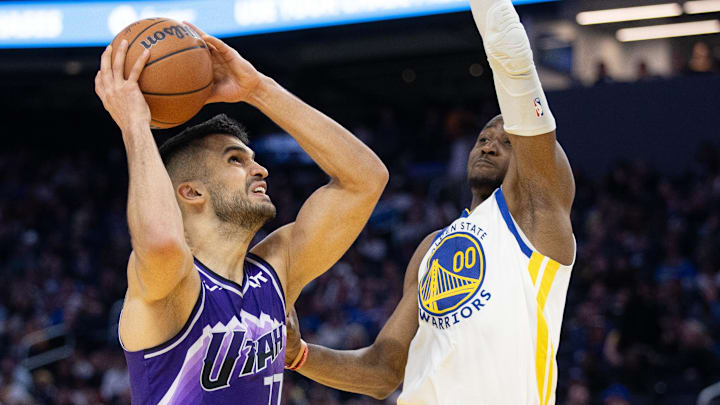 Apr 14, 2024; San Francisco, California, USA; Utah Jazz center Omer Yurtseven (77) goes up for a shot against Golden State Warriors forward Jonathan Kuminga (00) during the third quarter at Chase Center. Mandatory Credit: D. Ross Cameron-Imagn Images