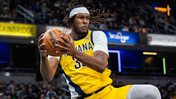 Feb 23, 2025; Indianapolis, Indiana, USA;  Indiana Pacers center Myles Turner (33) rebounds the ball in the first half against the LA Clippers at Gainbridge Fieldhouse. Mandatory Credit: Trevor Ruszkowski-Imagn Images