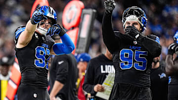 From left, Detroit Lions defensive tackle Roy Lopez (51), defensive end Aidan Hutchinson (97), and defensive end Pat O'Connor (95) react to a reverse call after referees’ second review during the second half at Ford Field in Detroit on Monday, Oct. 20, 2025.