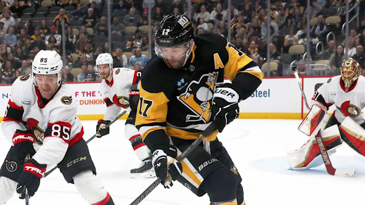 Mar 30, 2025; Pittsburgh, Pennsylvania, USA;  Ottawa Senators defenseman Jake Sanderson (85) defends Pittsburgh Penguins right wing Bryan Rust (17) during the third period at PPG Paints Arena. Mandatory Credit: Charles LeClaire-Imagn Images