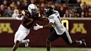 Oct 11, 2025; Minneapolis, Minnesota, USA; Minnesota Golden Gophers running back Fame Ijeboi (7) runs the ball as Purdue Boilermakers linebacker Alex Sanford (10) defends during the second half at Huntington Bank Stadium. Mandatory Credit: Matt Krohn-Imagn Images