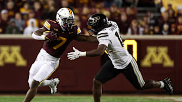 Oct 11, 2025; Minneapolis, Minnesota, USA; Minnesota Golden Gophers running back Fame Ijeboi (7) runs the ball as Purdue Boilermakers linebacker Alex Sanford (10) defends during the second half at Huntington Bank Stadium. Mandatory Credit: Matt Krohn-Imagn Images