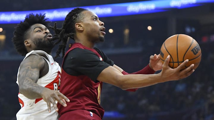 Jan 9, 2025; Cleveland, Ohio, USA; Cleveland Cavaliers guard Darius Garland (10) drives to the basket beside Toronto Raptors guard Jamal Shead (23) in the first quarter at Rocket Mortgage FieldHouse. Mandatory Credit: David Richard-Imagn Images Jan 9, 2025; Cleveland, Ohio, USA; Cleveland Cavaliers guard Darius Garland (10) drives to the basket beside Toronto Raptors guard Jamal Shead (23) in the first quarter at Rocket Mortgage FieldHouse. Mandatory Credit: David Richard-Imagn Images