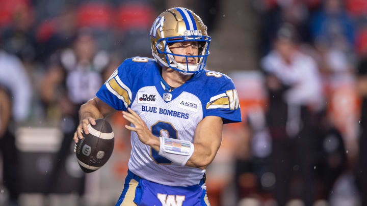 Jun 13, 2024; Ottawa, Ontario, CAN; Winnipeg Blue Bombers quarteback Zach Collards (8) holds the ball in the first hald against the Ottawa REDBLACKS at TD Place. Mandatory Credit: Marc DesRosiers-USA TODAY Sports