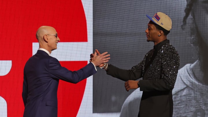 Ron Holland II shakes hands with NBA commissioner Adam Silver.