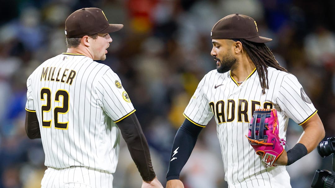 Apr 14, 2026; San Diego, California, USA; San Diego Padres relief pitcher Mason Miller (22) celebrates with right fielder Fernando Tatis Jr. (23) after defeating the Seattle Mariners at Petco Park. Mandatory Credit: David Frerker-Imagn Images