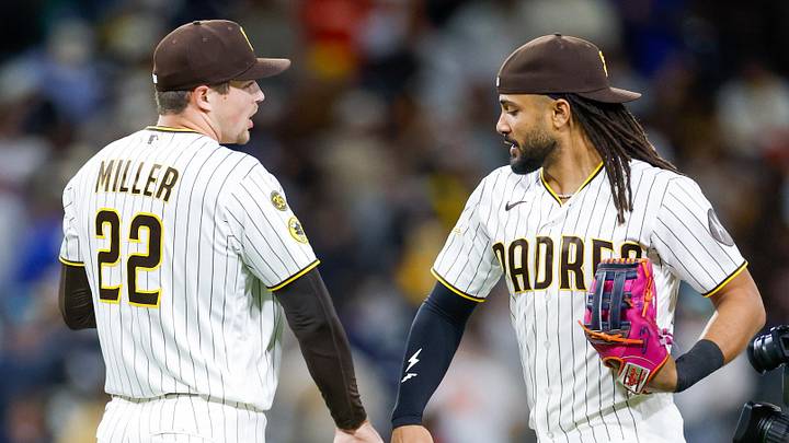 Apr 14, 2026; San Diego, California, USA; San Diego Padres relief pitcher Mason Miller (22) celebrates with right fielder Fernando Tatis Jr. (23) after defeating the Seattle Mariners at Petco Park. Mandatory Credit: David Frerker-Imagn Images