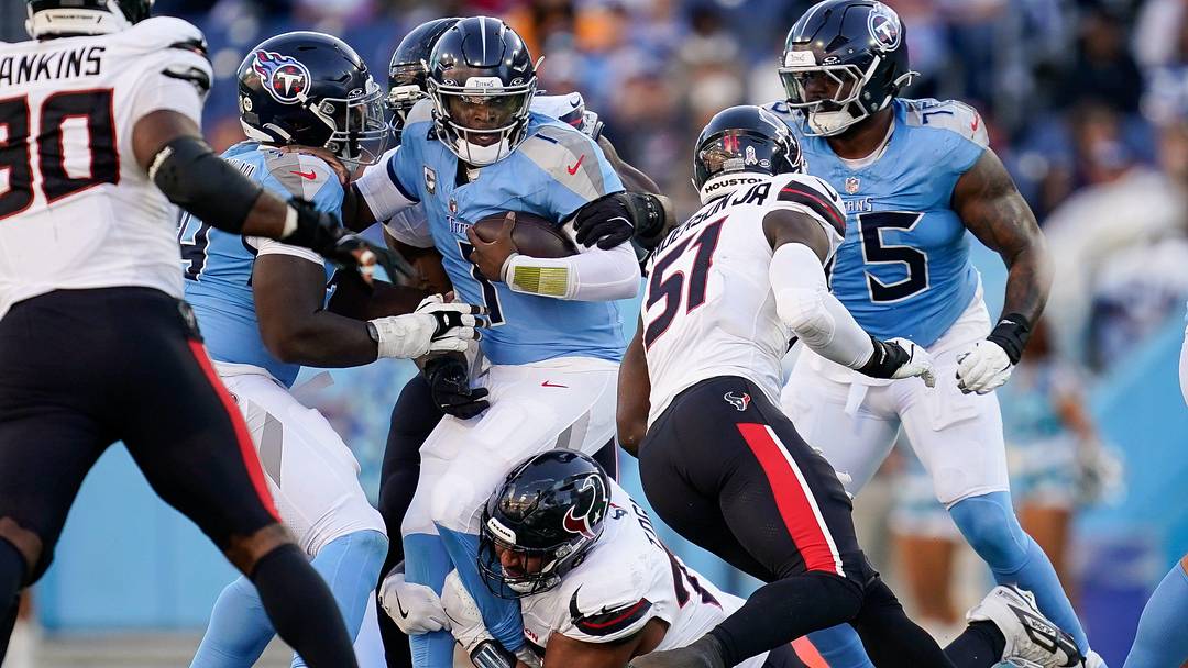 Tennessee Titans quarterback Cam Ward (1) is sacked by Houston Texans defensive tackle Tommy Togiai (72) during the fourth quarter at Nissan Stadium in Nashville, Tenn., Sunday, Nov. 16, 2025.