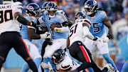 Tennessee Titans quarterback Cam Ward (1) is sacked by Houston Texans defensive tackle Tommy Togiai (72) during the fourth quarter at Nissan Stadium in Nashville, Tenn., Sunday, Nov. 16, 2025.