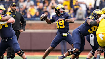 Team Blue quarterback Bryce Underwood (19) makes a pass against Team Maize during the first half of the spring game at Michigan Stadium in Ann Arbor on Saturday, April 19, 2025.