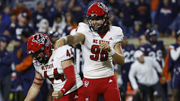 Sep 22, 2023; Charlottesville, Virginia, USA; North Carolina State Wolfpack place kicker Brayden Narveson (44) celebrates with Wolfpack punter Caden Noonkester (98) after making the game winning field goal on the final play of the game against the Virginia Cavaliers at Scott Stadium. Mandatory Credit: Geoff Burke-Imagn Images