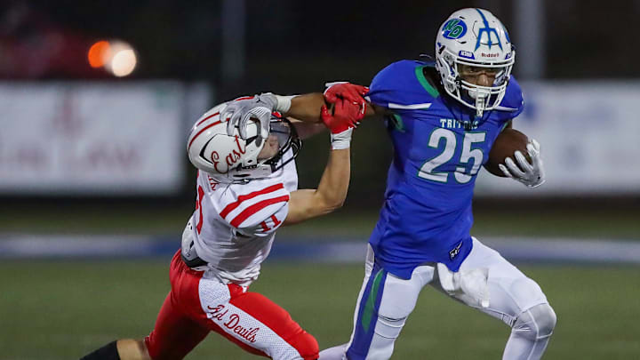 Notre Dame Academy's Kingston Allen (25) stiff-arms Green Bay East High School's Rowan Allen (11) on Thursday, September 12, 2024, at Notre Dame Academy in Green Bay, Wis. Notre Dame won the game, 56-0, to stay undefeated on the season.
Tork Mason/USA TODAY NETWORK-Wisconsin