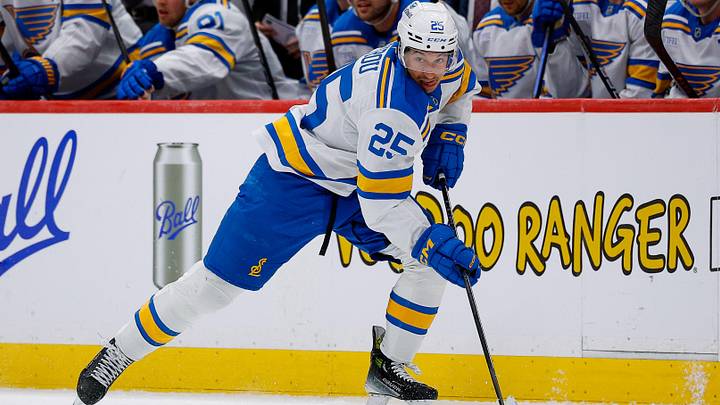 Apr 5, 2026; Denver, Colorado, USA; St. Louis Blues right wing Jordan Kyrou (25) controls the puck in the third period against the Colorado Avalanche at Ball Arena. Mandatory Credit: Isaiah J. Downing-Imagn Images
