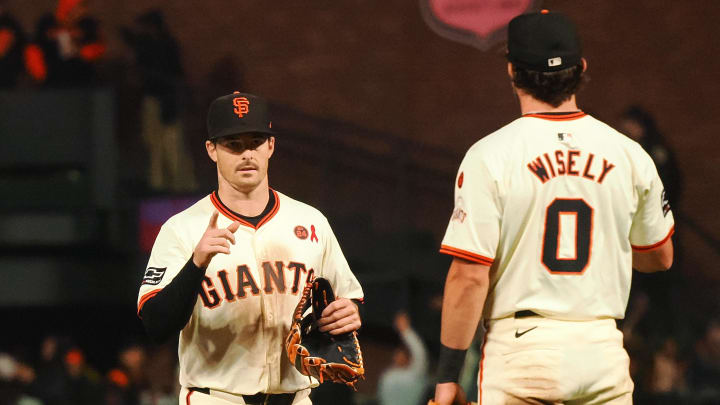 Jul 31, 2024; San Francisco, California, USA; San Francisco Giants right fielder Mike Yastrzemski (5) points to second baseman Brett Wisely (0) after the game against the Oakland Athletics at Oracle Park. 