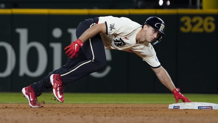 Aug 16, 2024; Arlington, Texas, USA; Texas Rangers outfielder Wyatt Langford (36) remains in contact with the base as he advances to second on an RBI single during the sixth inning against the Minnesota Twins at Globe Life Field. Mandatory Credit: Raymond Carlin III-USA TODAY Sports