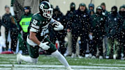 Nov 30, 2024; East Lansing, Michigan, USA;  Michigan State Spartans tight end Jack Velling (12) sprints upfield after catching a second quarter pass against the Rutgers Scarlet Knights at Spartan Stadium. Mandatory Credit: Dale Young-Imagn Images