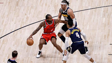 Apr 21, 2025; Denver, Colorado, USA; Los Angeles Clippers forward Kawhi Leonard (2) controls the ball as Denver Nuggets forward Aaron Gordon (32) and guard Russell Westbrook (4) guards in the fourth quarter during game two of first round for the 2025 NBA Playoffs at Ball Arena. Mandatory Credit: Isaiah J. Downing-Imagn Images