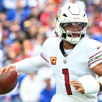 Sep 8, 2024; Orchard Park, New York, USA; Arizona Cardinals quarterback Kyler Murray (1) runs out of the pocket against the Buffalo Bills in the first quarter at Highmark Stadium. Mandatory Credit: Mark Konezny-Imagn Images