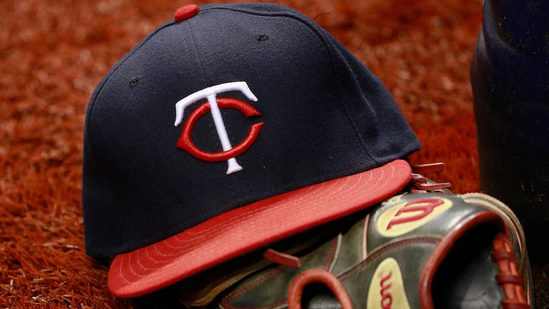 Aug 25, 2015; St. Petersburg, FL, USA; Minnesota Twins hat and glove lays on the field during the game against the Tampa Bay Rays at Tropicana Field.