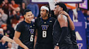 Tyler Harris, middle, is surrounded by fellow Huskies Tyree Ihenacho (6) and Great Osobor, right. 