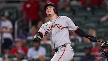 Jul 22, 2025; Atlanta, Georgia, USA; San Francisco Giants designated hitter Wilmer Flores (41) hits a three-run home run against the Atlanta Braves in the seventh inning at Truist Park.
