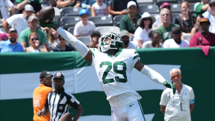 East Rutherford, NJ -- August 10, 2024 -- Jarrick Bernard-Converse of the Jets breaks up a pass intended for Olamide Zaccheaus of the Commanders in the first half as the Washington Commanders came to MetLife Stadium to play the New York Jets.