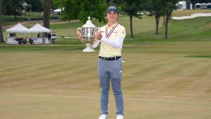 Yuka Saso holding the 2024 U.S. Women's Open trophy, which she kept in her car. 