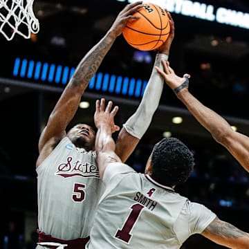 Michigan State center Mady Sissoko (22) and Mississippi State guard Shawn Jones Jr. (5), forward Tolu Smith (1) battle for a rebound during the second half of NCAA tournament West Region first round at Spectrum Center in Charlotte, N.C. on Thursday, March 21, 2024.