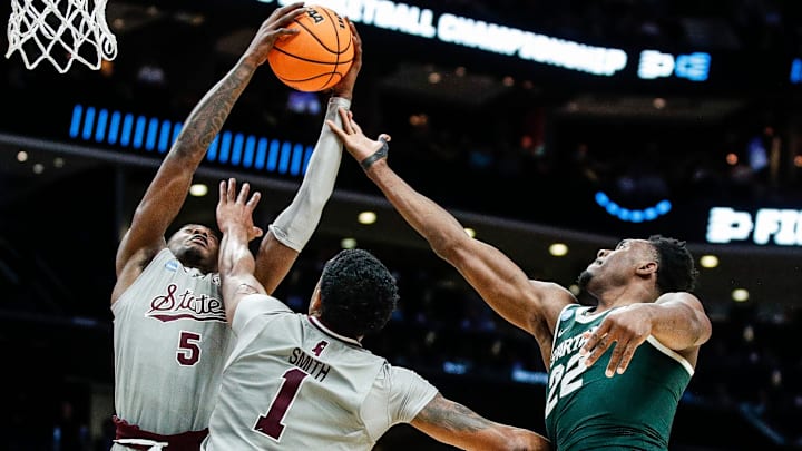 Michigan State center Mady Sissoko (22) and Mississippi State guard Shawn Jones Jr. (5), forward Tolu Smith (1) battle for a rebound during the second half of NCAA tournament West Region first round at Spectrum Center in Charlotte, N.C. on Thursday, March 21, 2024.