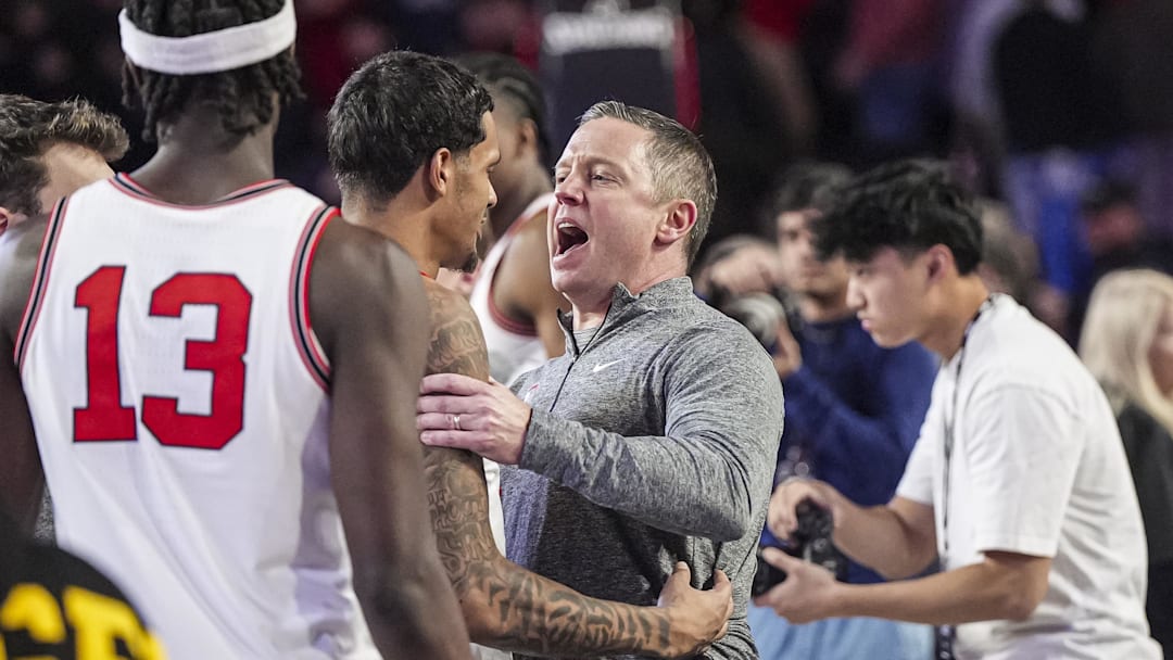Jan 11, 2025; Athens, Georgia, USA; Georgia Bulldogs guard De'Shayne Montgomery (2) and head coach Mike White react after defeating the Oklahoma Sooners at Stegeman Coliseum. Mandatory Credit: Dale Zanine-Imagn Images
