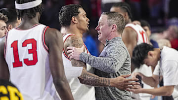 Jan 11, 2025; Athens, Georgia, USA; Georgia Bulldogs guard De'Shayne Montgomery (2) and head coach Mike White react after defeating the Oklahoma Sooners at Stegeman Coliseum. Mandatory Credit: Dale Zanine-Imagn Images