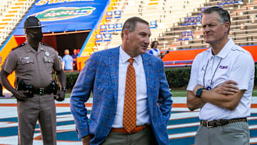 Florida Gators head coach Dan Mullen talks with UF Athletic Director Scott Stricklin, right, after Gator Walks. Fans tailgate before the start of the season opener of the Florida Gators vs the Florida Atlantic Owls Saturday afternoon, September 4, 2021 in Gainesville, FL. Gators perform the Gator Walk after a year hiatus because of COVID-19.  [Doug Engle/Ocala Star Banner]2021

Flgai Ufvsfau 090421