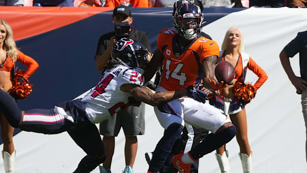 Denver Broncos wide receiver Courtland Sutton (14) is defended by Houston Texans cornerback Derek Stingley Jr. (24).