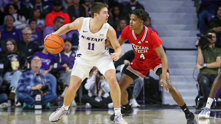 Jan 14, 2025; Manhattan, Kansas, USA; Kansas State Wildcats guard Brendan Hausen (11) is guarded by Texas Tech Red Raiders guard Christian Anderson (4) during the second half at Bramlage Coliseum. Mandatory Credit: Scott Sewell-Imagn Images