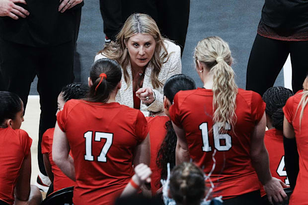 Louisville head coach Dani Busboom Kelly instructed her players against Penn State.