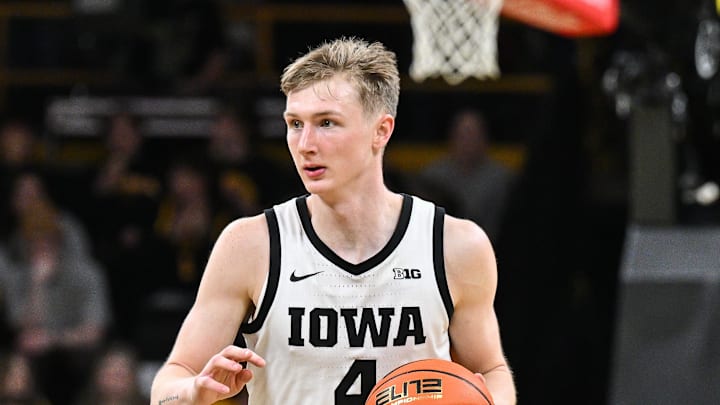 Mar 6, 2025; Iowa City, Iowa, USA; Iowa Hawkeyes guard Josh Dix (4) brings the ball up court against the Michigan State Spartans during the second half at Carver-Hawkeye Arena. Mandatory Credit: Jeffrey Becker-Imagn Images