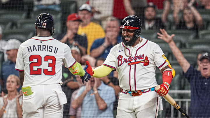 Sep 23, 2025; Cumberland, Georgia, USA; Atlanta Braves center fielder Michael Harris II (23) reacts with designated hitter Marcell Ozuna (20) after hitting a home run against the Washington Nationals during the seventh inning at Truist Park. Mandatory Credit: Dale Zanine-Imagn Images