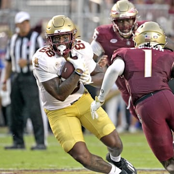 Sep 2, 2024; Tallahassee, Florida, USA; Boston College Eagles tight end Kamari Morales (88) runs the ball against Florida State Seminoles defensive back Shyheim Brown (1) during the first quarter at Doak S. Campbell Stadium. Mandatory Credit: Melina Myers-Imagn Images