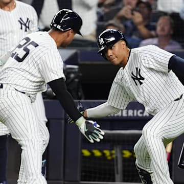 Sep 12, 2024; Bronx, New York, USA; New York Yankees right fielder Juan Soto (22) congratulated New York Yankees second baseman Gleyber Torres (25) for hitting a home run against the Boston Red Sox during the first inning at Yankee Stadium.