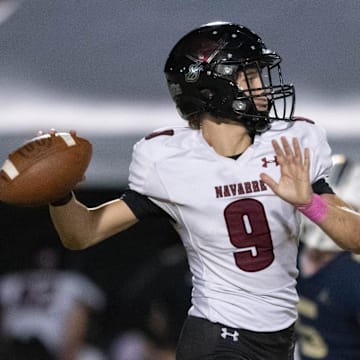 Quarterback Roman Marshall (9) gets set to pass during the Navarre vs Gulf Breeze football game at Gulf Breeze High School on Friday, Oct. 18, 2024.