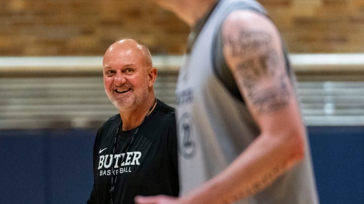 Butler head coach Thad Matta smiles at Butler forward Patrick McCaffery (22) on Tuesday, June 25, 2024, during a Butler University men’s basketball practice in a practice facility at Hinkle Fieldhouse in Indianapolis.