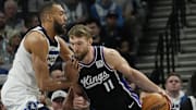 Feb 3, 2025; Minneapolis, Minnesota, USA; Sacramento Kings center Domantas Sabonis (11) works against Minnesota Timberwolves center Rudy Gobert (27) in the first quarter at Target Center. Mandatory Credit: Bruce Kluckhohn-Imagn Images