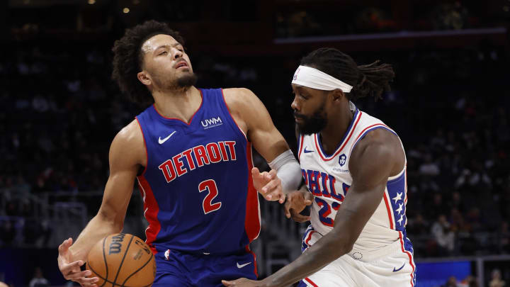 Dec 13, 2023; Detroit, Michigan, USA;  Detroit Pistons guard Cade Cunningham (2) dribbles and is fouled by Philadelphia 76ers guard Patrick Beverley (22) in the second half at Little Caesars Arena. Mandatory Credit: Rick Osentoski-USA TODAY Sports