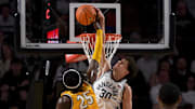 Vanderbilt Commodores guard Chris Manon (30) blocks the shot of  Missouri Tigers guard Mark Mitchell (25) during the first half at Memorial Gymnasium.