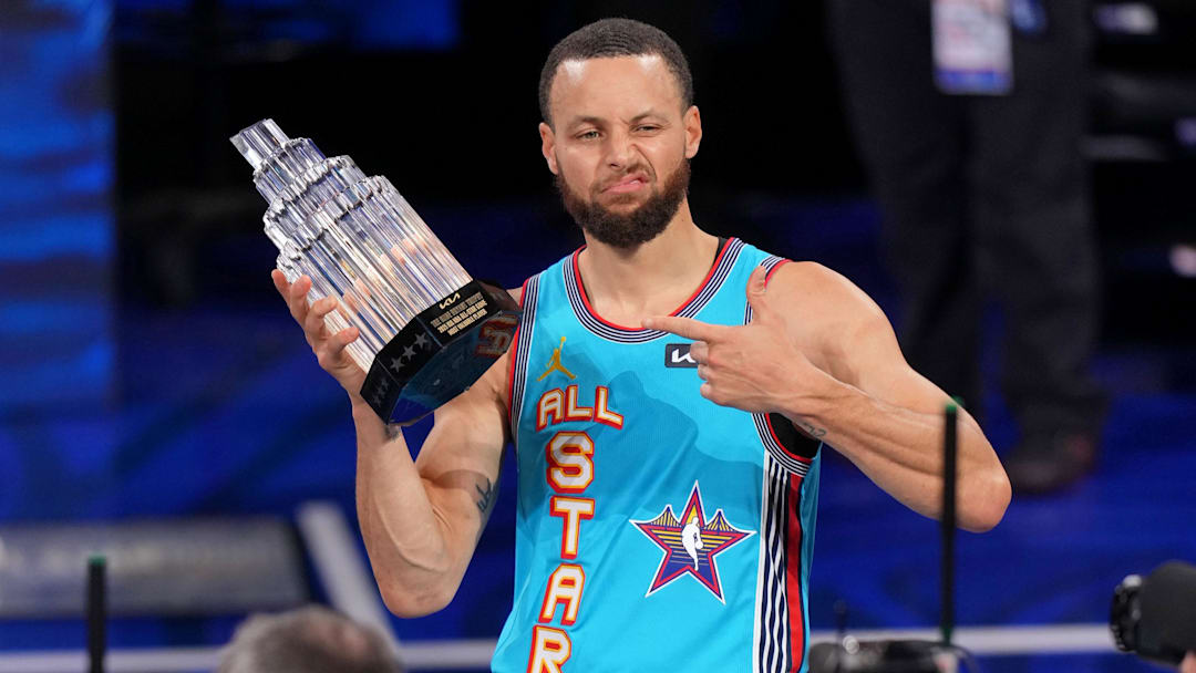 Feb 16, 2025; San Francisco, CA, USA; Shaqís OGs guard Stephen Curry (30) of the Golden State Warriors holds up the MVP trophy after winning the 2025 NBA All Star Game at Chase Center. Mandatory Credit: Cary Edmondson-Imagn Images