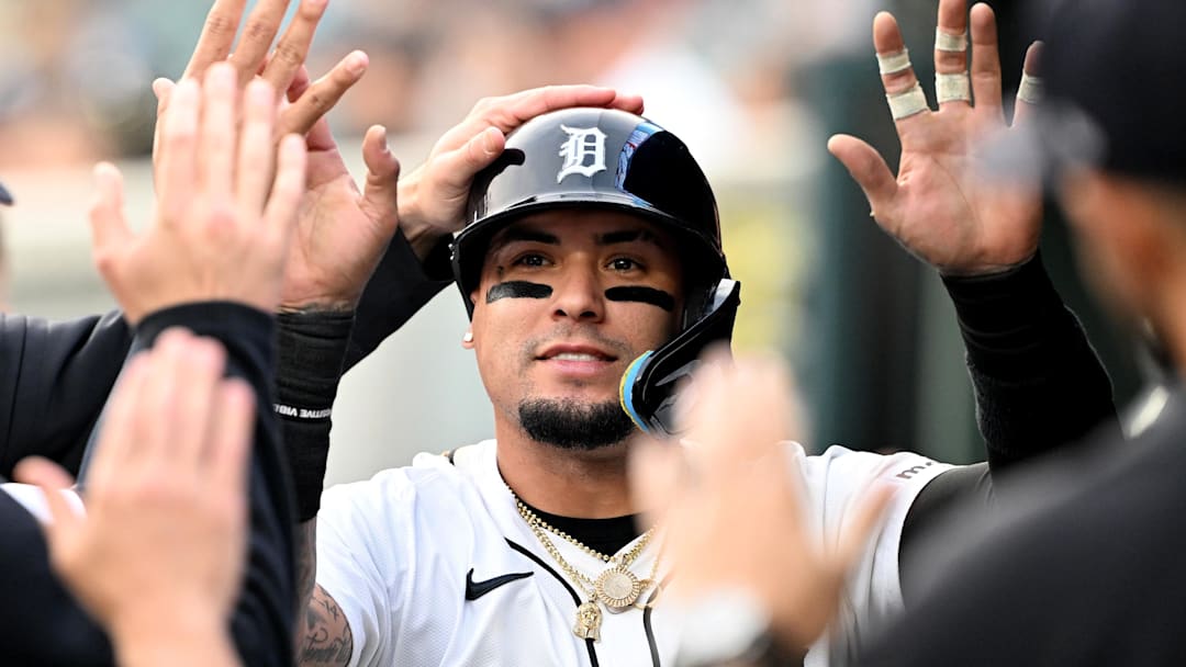 Detroit Tigers shortstop Javier Baez (28) celebrates in the dugout after scoring a run against the Chicago Cubs in the fifth inning at Comerica Park. 
