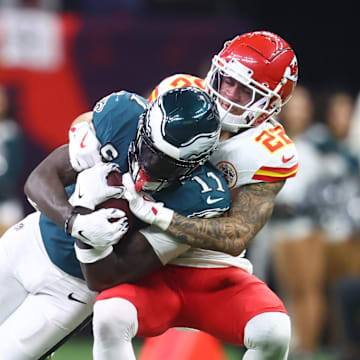 Philadelphia Eagles wide receiver A.J. Brown is tackled by Kansas City Chiefs cornerback Trent McDuffie during Super Bowl LIX.
