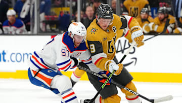 Dec 3, 2024; Las Vegas, Nevada, USA; Edmonton Oilers center Connor McDavid (97) defends against Vegas Golden Knights center Jack Eichel (9) during the second period at T-Mobile Arena. Mandatory Credit: Stephen R. Sylvanie-Imagn Images