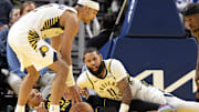 Nov 9, 2025; San Francisco, California, USA; Golden State Warriors guard Will Richard (3) and Indiana Pacers forward Cody Martin (11) fall to the floor while Indiana Pacers guard Andrew Nembhard (2) picks up the loose ball they were fighting for during the fourth quarter at Chase Center. Mandatory Credit: D. Ross Cameron-Imagn Images